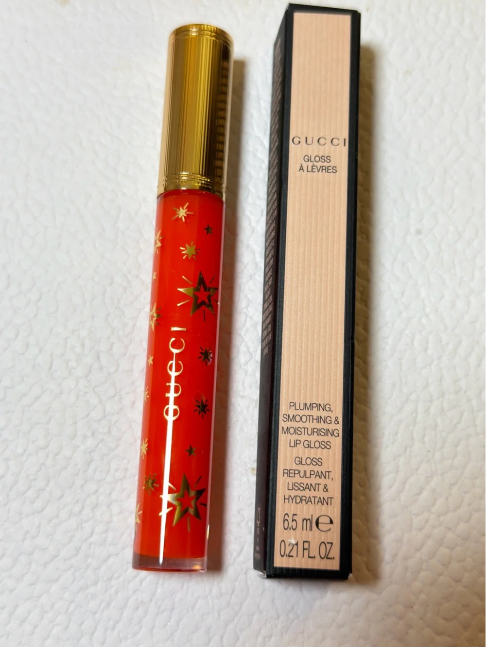 Gucci Orange-Red Lip Gloss with Gold Star Accents